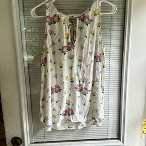 Flowy sleeveless top. Gently used. White with purple and yellow flowers
